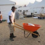 Right – Welterweight champion Andre Berto volunteering at the Project Medishare Hospital shortly after the earthquake.